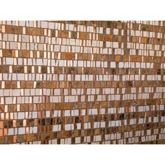 a brown and white tile wall with different colors