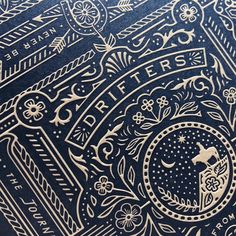 an intricately designed blue book with gold lettering