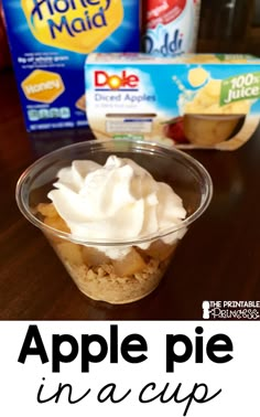 an apple pie in a cup with yogurt and other ingredients on the side