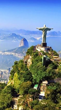 the statue of christ stands on top of a mountain