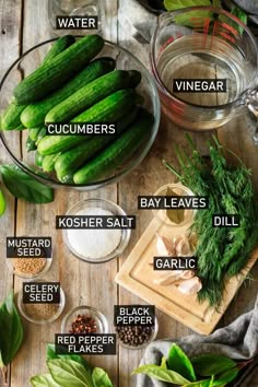 cucumbers, bay leaves, dill, garlic and other ingredients on a wooden table