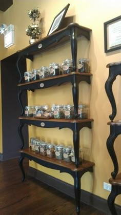 the shelves are filled with jars and knick - knacks