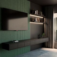 a living room with green walls and shelves on either side of the wall is a large window