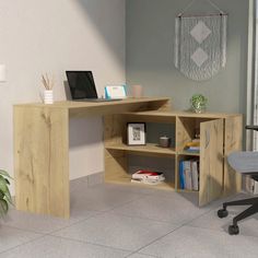 a computer desk with a laptop on top of it next to a chair and potted plant