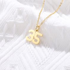 Whether looking for something simple or a little more extravagant, our men's collection customized number necklace is your best stop. This necklace is made with Sterling Silver, with numbers arranged on a matching Sterling Silver Rollo Chain that surely make him fall for you. S I Z E ∙ AND ∙ M A T E R I A L S ■ Pendant Size: 1.1″ x 0.47″ / 28mm x 12mm ■ Chain Length: 14″ (35cm), 16″ (40cm), 18″ (45cm), 20″ (50cm), 22″ (55cm) M A T E R I A L ■ Made from Sterling Silver ■ Designed to never fade, r Baseball Numbers, Football Numbers, Sports Numbers, Softball Jerseys, Number Necklace, Silver Numbers, Varsity Style, Sporty Design, Lucky Number