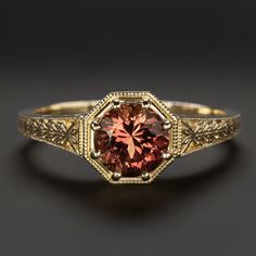 Why we love it:Featuring a rich red tourmaline, this solitaire ring is beautifully crafted with romantic, vintage style details!Highlights:- 1.15ct tourmaline center with rich red color and a lively play of light- Romantic vintage style details- Buttery 14k yellow goldDimensions:7.9mm across (north-south) and 5.8mm from the finger to the top of the ring.