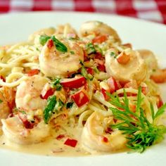 creamy garlic shrimp pasta on a white plate