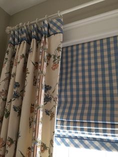 a window with blue and white checkered curtains