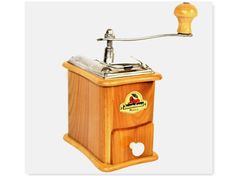 an old fashioned wooden grinder with a handle on it's head and the word,