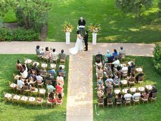 an overhead view of a wedding ceremony with the bride and groom standing at the alter