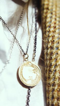 The Ouroboros, a snake eating its own tail, the circular nature of life. Hand engraved pendant on 20” oxidized silver chain. Available in 10k gold or sterling silver. Handmade to order in New York and Mexico City. Please allow up to three weeks for delivery. Snake Eating, The Ouroboros, Engraved Pendant, A Snake, Oxidized Silver, Hand Engraving, Mexico City, 10k Gold, Silver Chain