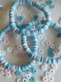 several blue and white beads are arranged on a table