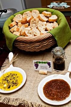 there are many different foods in the basket on the table and one has bread, sauces, and other condiments