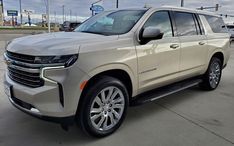 a white suv parked in a parking lot