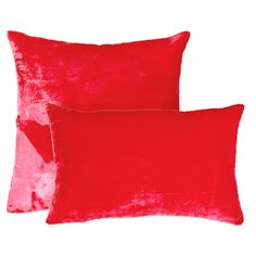 two bright pink velvet pillows on a white background, one is plain and the other is plain