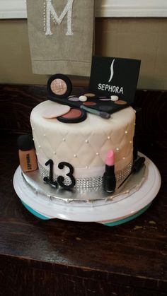 there is a cake that has makeup on it and the name sephora on top