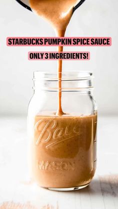 starbucks pumpkin spice sauce being poured into a mason jar with text overlay that reads starbucks pumpkin spice sauce only 3 ingredients