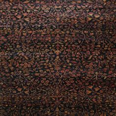 an old rug with floral designs on it, in black and red colors stock photo