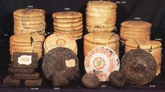 several stacks and piles of tea bags with labels on them