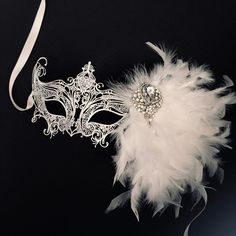 Dazzle and enchant with our women's white metal masquerade mask. The white feather clip adds a touch of playfulness and grace, swaying with your every movement. The sparkling rhinestones and brooch on the mask add a touch of glamour, reflecting your inner brilliance. From grand masquerade balls to themed soirées and enchanting celebrations, our Venetian-style mask will elevate your allure to celestial heights!


Age Group/Gender - Adult/Women

Size/Type - One size fits all adults

Mask Color - W Mascarade Ball Dresses, Wedding Masquerade, White Masquerade Mask, White Masquerade, Masquerade Mask Women, Elegant Face Mask, Mask Venetian, Mask White, Metal Mask