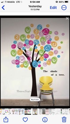 an image of a tree with colorful circles on it and the words love is in the air