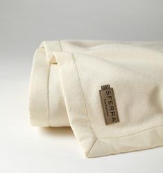 a white blanket with a tag on it