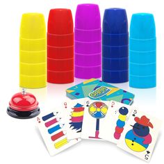 several different colored plastic cups and playing cards