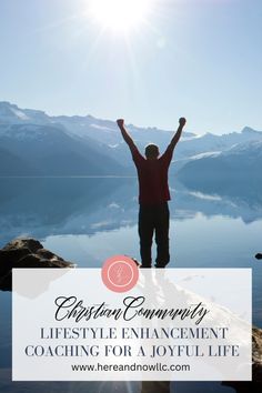 a person standing on top of a lake with their arms in the air