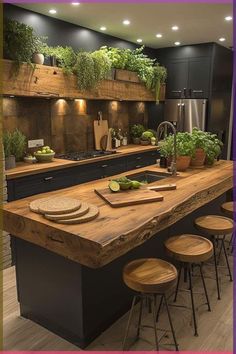 a kitchen with an island and wooden stools in front of the counter top, surrounded by potted plants