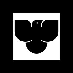 a black and white square with an elephant's head in the center, on a dark background