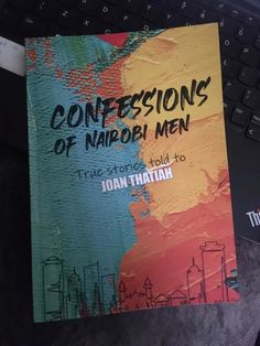 a book sitting on top of a laptop computer next to a keyboard and mouse with the title'confessionss of nappy men true stories told to joan thaattain