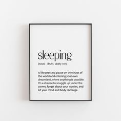 a black and white framed poster with the words sleeping on it's back side