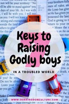 colorful toy cars sitting on top of an open book with the words keys to raising godly boys