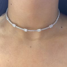 This exquisite choker necklace is crafted from 18Kt white gold and adorned with a total of 2.35 carats of diamonds. The diamonds are of G-H color and VS2 clarity, ensuring a dazzling brilliance and excellent quality. The necklace features both baguette and round cut diamonds, creating a beautiful and sophisticated design that elegantly complements any outfit. Luxury Diamond White Rectangular Necklace, Silver Cubic Zirconia Tennis Choker Necklace, Fine Jewelry Silver Diamond Choker, Fine Jewelry Silver Diamond Choker Necklace, Silver Diamond Choker Necklace Fine Jewelry, Luxury Choker For Anniversary, Fine Jewelry White Gold Diamond Choker Necklace, Formal Cubic Zirconia Diamond Choker Necklace, Luxury Diamond Choker Jewelry