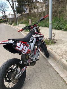 a dirt bike is parked on the side of the road