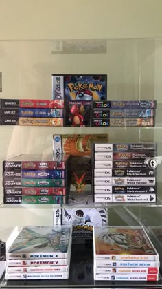 several video games are on display in a glass case