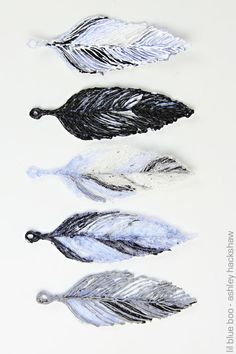 three different types of feathers are shown in this image, one is black and the other is white