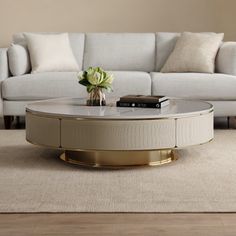 a living room with a white couch and table