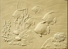 an image of some fish and plants in the sand with watermarks on it