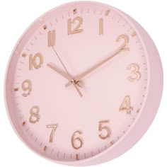 a pink wall clock with gold numbers on the face and hands is shown in front of a white background