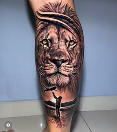 a man's leg with a lion tattoo on it