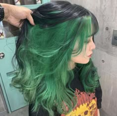 #hairstyle #dyehair #trendy Are you looking to make a bold statement with your hairstyle? Then try dyeing it green! In this video, we'll show you how to get the perfect green-dyed hairstyle. From choosing the right shade of green for your complexion, to picking the best hair products for coloring and protecting your hair, we've got all the tips and tricks you need. We'll also show you some easy styling ideas so that you can rock this vibrant look like a pro. #hairstyle #trendy #trendyfashion #dy Green Hair Black Underneath, Black And Green Peekaboo Hair, Dark Green Skunk Stripe Hair, Dark Green Tips Hair, Medium Length Green Hair, Black And Green Hair Aesthetic, Green Hair Split Dye, Green Hair Peekaboo, Peekaboo Hair Color Green