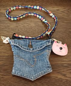 Clean, adorable. Double sided pocket so you can put things in each area. Approximately 5" by 6" with a 14" drop with the strap. No stains or tears. Comes with two Keychain accessories! Denim Pockets Projects, Jean Keychain, Denim Keychain, Strap Keychain, Pink Kitty, Pretty Shoes Sneakers, Keychain Accessories, Denim Pocket, Accessory Ideas