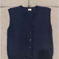 Never Worn. Extra Button Included. Fitted Blue Sweater Vest For Winter, Casual Navy Sweater With Buttons, Classic Blue Sweater Vest For Winter, Classic Winter Sweater Vest With Button Closure, Navy Cotton Sweater Vest For Winter, Classic Blue Knit Outerwear, Blue Knitted Wool Tops, Classic Blue Winter Sweater Vest, Blue Fitted Buttoned Sweater