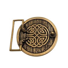 a brass belt buckle with an intricate design