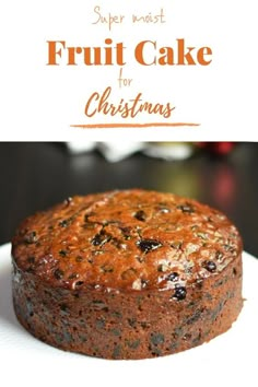 a close up of a cake on a plate with the words super moist fruit cake for christmas