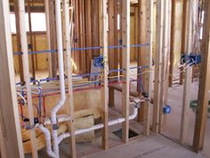 a room that is under construction with pipes and piping