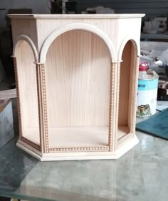 a wooden shelf sitting on top of a table