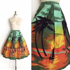 "vintage skirt  Era: 1950's Label: none Material: cotton Closure: back metal zipper, button waist Colour: green, orange, yellow, black  Details: vivid sun set scene with shadowed silhouettes of palm trees and sail boats in the distant horizon Fits like: small Waist: 26\" Hips: free Length: 30 Condition: excellent other than some very mild wash fade to the cotton. Priced accordingly. Washed and ready to wear.   shop policy  * All items are a final sale. No returns, exchanges and, order cancellations are not accepted.  * Ruby Mae Rose is not responsible for lost or stolen parcel(s) and any duty, import, VAT charges that are determined by the receiving country. Ruby Mae Rose will not mark the parcel as a 'gift' as this is illegal. Thank you for your understanding. * Vintage naturally shows si Ruby Mae, 1950s Skirt, Womens Skirts, Sun Set, Rose Vintage, 50s Vintage, Border Print, Star Dress, 50s Fashion