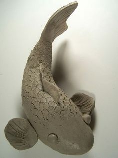 a sculpture of a fish on the wall